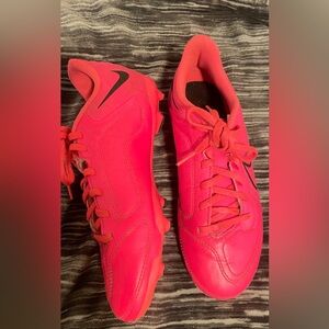 Nike Tiempo Youth soccer cleats. 
Bright pink with black trim.  youth size 5.5